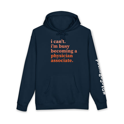 Navy hoodie printed with "i can't. i'm busy becoming a physician associate." in orange text and "#PAsGoBeyond" printed vertically down the sleeve.