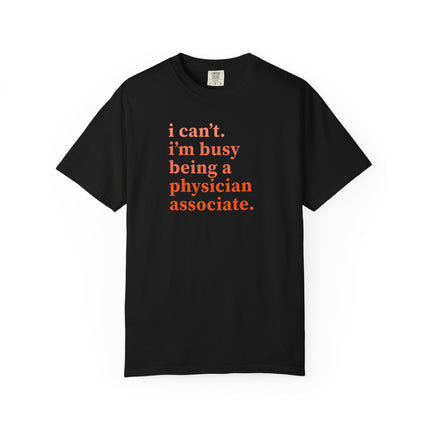 Black t-shirt printed with "i can't. i'm busy being a physician associate." in orange text.