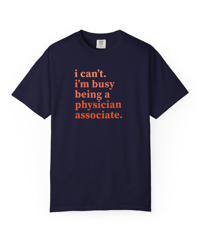 Navy t-shirt printed with "i can't. i'm busy being a physician associate." in orange text.