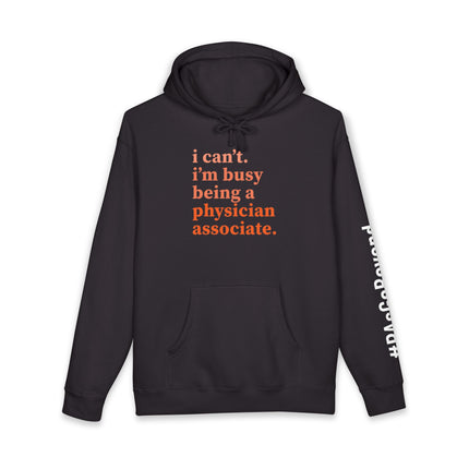 Black hoodie printed with "i can't. i'm busy being a physician associate." in orange text and "#PAsGoBeyond" printed vertically down the sleeve.