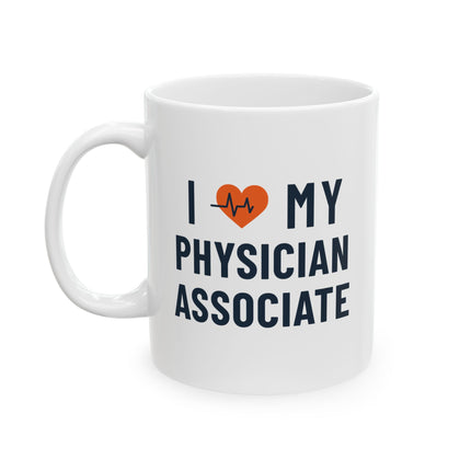 White ceramic mug printed with "I heart my Physician Associate" featuring an orange heart with a heartbeat line, and "Physician Associate" in navy text below.