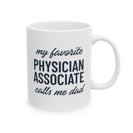 White ceramic mug printed with "My favorite Physician Associate calls me dad" in navy text.