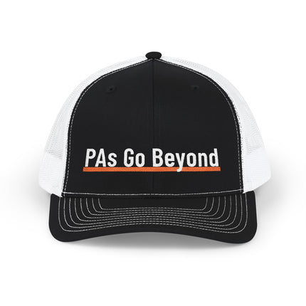Black and white trucker hat embroidered with "PAs Go Beyond" in white text, underlined with an orange stripe.