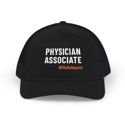 Black trucker hat embroidered with "Physician Associate" in white text and "#PAsGoBeyond" in orange.