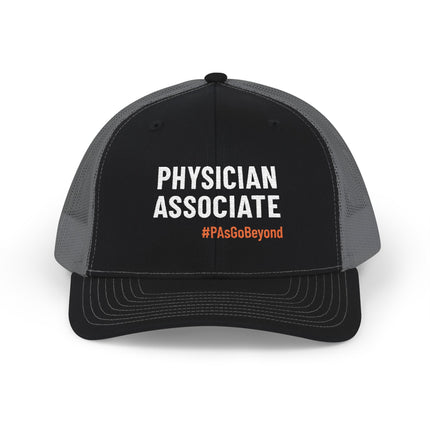 Black and grey trucker hat embroidered with "Physician Associate" in white text and "#PAsGoBeyond" in orange.