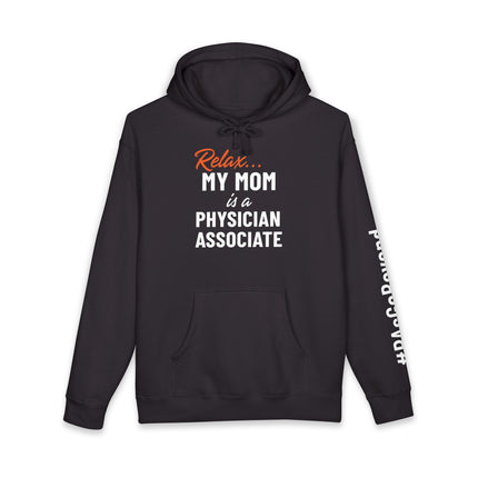 Black hoodie printed with "Relax..." in orange script above "My mom is a Physician Associate" in white text, with "#PAsGoBeyond" printed vertically down the sleeve.