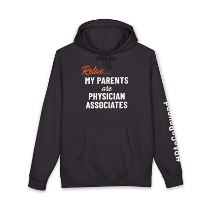Black hoodie printed with "Relax..." in orange script above "My parents are Physician Associates" in white text, with "#PAsGoBeyond" printed vertically down the sleeve.